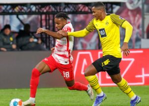 Manuel Akanji challenges Christopher Nkunku in Borussia Dortmund vs RB Leipzig
