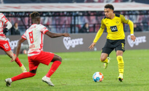 Borussia Dortmund's Donyell Malen takes on RB Leipzig's Amadou Haidara