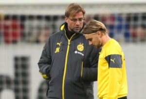 Marcel Schmelzer and Jürgen Klopp of Borussia Dortmund